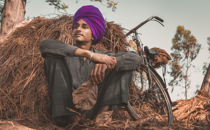 A teenager gazing at the open fields in Punjab.