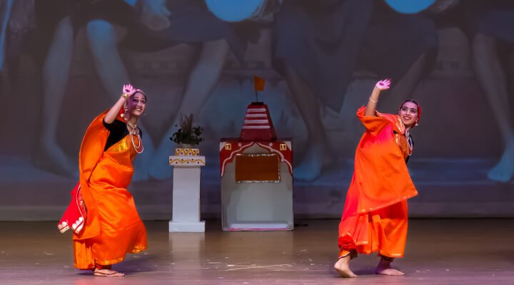 NSDA students in a formation on stage.