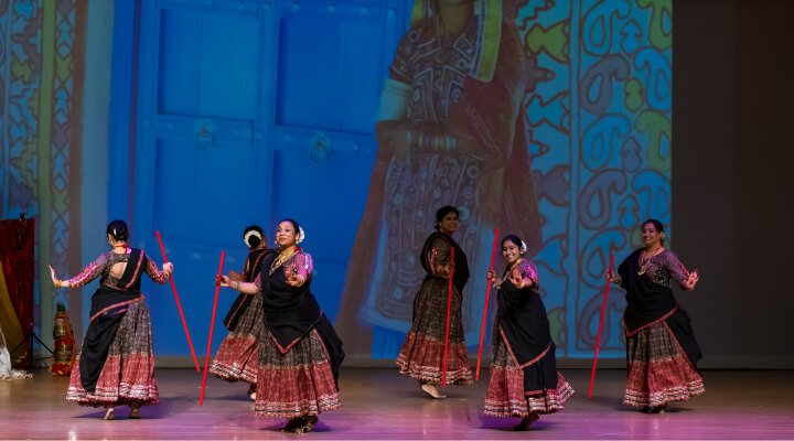 NSDA students in a circular formation on stage.