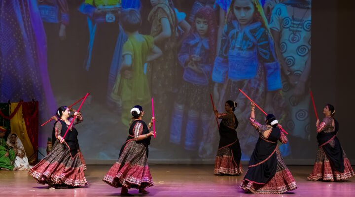 NSDA students performing the tippani folk dance on stage..