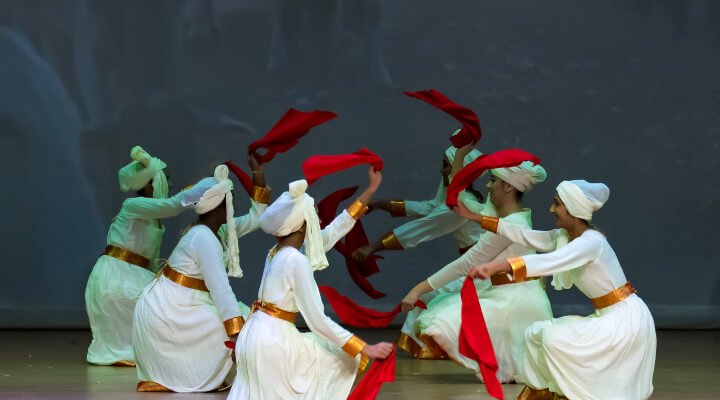 NSDA studens waving scarves during the Dhangar dance.