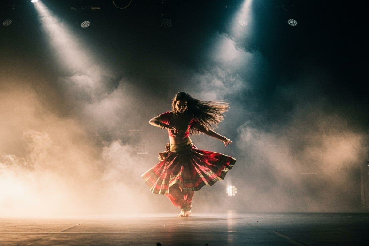 A dancer performing an Indian folk fusion dance on stage.