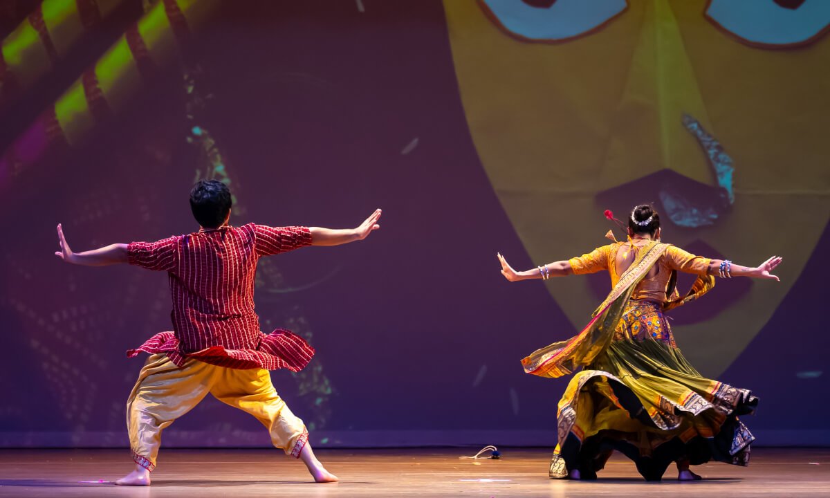 NSDA students in a pose with their bbacks facing the audience.
