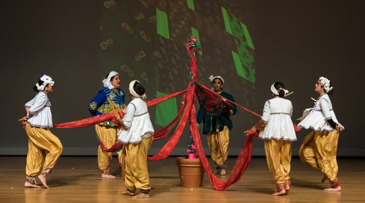 NSDA students performing Gof-Gunthan dance on stage.