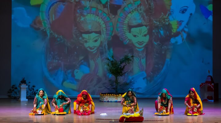 Dancers placing their clay figurines on the floor before the performance.
