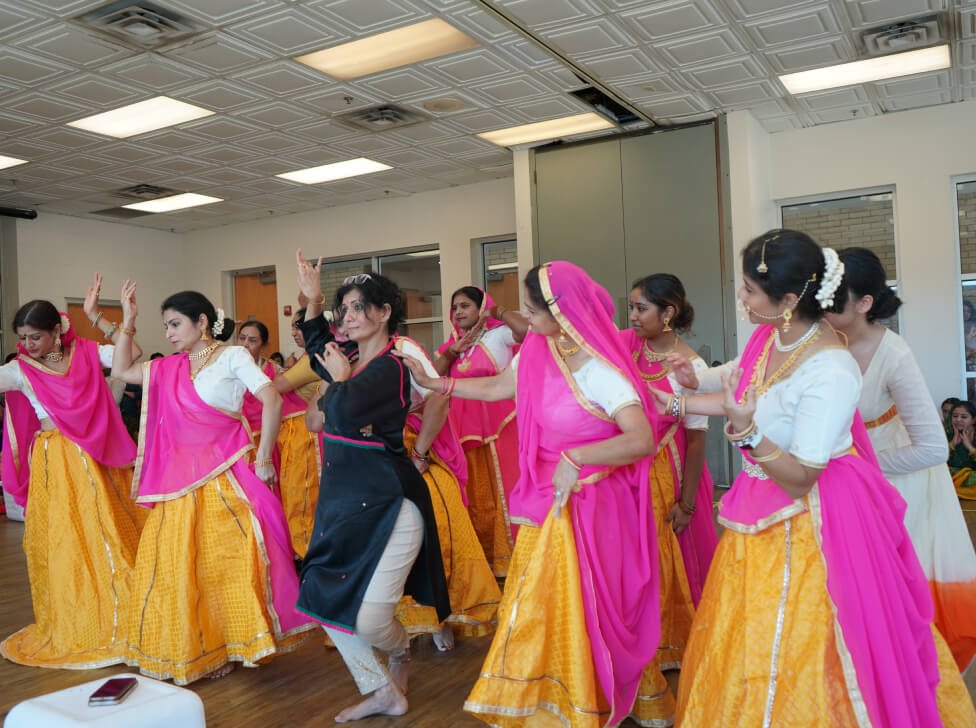 Vandita Parikh guiding students at different skill levels during a dance class.